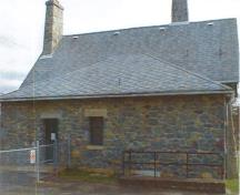 Exterior view of the Belmont Road Main Gatehouse, showing its modest scale and distinctive appearance, 2000.; Department of National Defence/Ministère de la Défense nationale, D. Cebula, 2000.