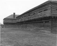 Rear view of Blockhouse 2, showing the long, rectangular, two-storey massing, circa 1989.; Parks Canada Agency / Agence Parcs Canada, circa 1989.