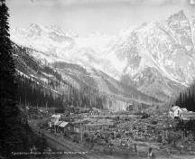 General view of Rogers Pass National Historic Site of Canada, showing the former rail line and facilities, circa 1900-1925.; Albertype Company / Library and Archives Canada - Bibliothèque et Archives Canada / PA - 032019, ca/v. 1900-1925.