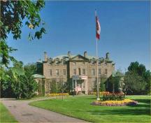 General view of the Old Government House National Historic Site of Canada, showing the front elevation, 1990.; Parks Canada Agency / Agence Parcs Canada, 1990.