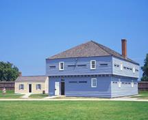 General view of Blockhouse 3, showing the long, rectangular, two-storey massing and the low-pitched hipped roof, 1994.; Parks Canada Agency / Agence Parcs Canada, B. Morin, 1994.