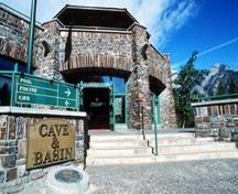 Detail view of the main entrance to the Cave and Basin Bathing Pavilion  showing the use of natural materials consistent with the principles of rustic architecture, 1988.; Parks Canada Agency / Agence Parcs Canada, W. Lynch, 1988.