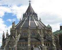 Exterior view of the Parliament Library showing its High Victorian Gothic Revival style, including its circular plan, chapter house-inspired design, 2010.; Parks Canada / Parcs Canada, Catherine Beaulieu 2010.