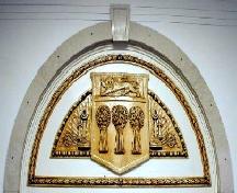 Close-up of moulded provincial crest and telephone motif, 2000; Government of Saskatchewan, 2000.