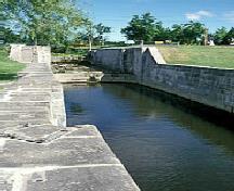 General view of Carillon Canal, showing the old south stone wall, 1999.; Parks Canada Agency / Agence Parcs Canada, Bergeron J.F, 1999.