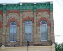 Second storey windows with decorative brickwork.; Photographs taken by Dana Johnson, May 31st, 2010.