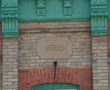 This engraved date stone on the second storey face reads “IOOF 1890”; Photographs taken by Dana Johnson, May 31st, 2010.