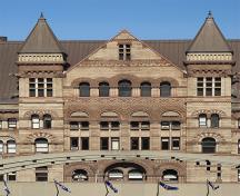 General view of Old Toronto City Hall and York County Court House, showing its elaborate stone detailing, including grotesques, voussoirs and carved window surrounds, mullions, colonettes, carved panels, 2007.; Old Toronto City Hall and York County Court House, deymosD, June 2007.