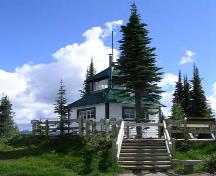 View of the façade and north elevation showing its modest size and two-storey wood frame construction.; Parks Canada Agency / Agence Parcs Canada, 2011