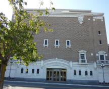 General view of Royal Theatre, showing the surviving classically inspired, exterior detailing including the arched entry, 2011.; Parks Canada Agency / Agence Parcs Canada, Andrew Waldron, 2011.
