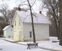 View of the John Walter 1884 squared log house looking at the south and east elevations (January 2005).; City of Edmonton, 2005