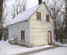 View of the John Walter 1875 squared log house looking at the south and west elevations (January 2005). ; City of Edmonton, 2005