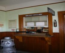 View of ticket wicket in waiting room of the Morden Canadian Pacific Railway Station, Morden, 2011; Historic Resources Branch, Manitoba Culture, Heritage and Tourism, 2011