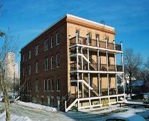 This image shows the large south balconies and the rear west-facing facade of the Ross Flats Apartment.; City of Edmonton, 2004