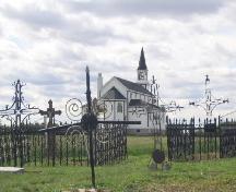 View west at iron cross grave markers and enclosures, 2004.; Government of Saskatchewan, Marvin Thomas, 2004.