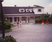 View of the main entrance to Villa Reford, showing its wood construction in the Regency style, 1994.; Parks Canada Agency / Agence Parcs Canada, N. Clerk, 1994.