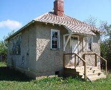 View of Oscar Lake School showing the front entrance and the west window wall, 2007.; Government of Saskatchewan, Brett Quiring, 2007.