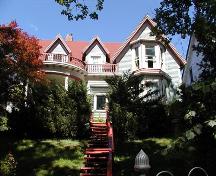 Front elevation with trees blocking view, James Austin House, Dartmouth, Nova Scotia, 2005.; Heritage Division, NS Dept. of Tourism, Culture and Heritage, 2005.