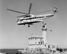 Historic photograph of Triple Islands Lighthouse, 1967.; Library and Archives Canada, Department of Transport | Bibliothèque et Archives Canada, Ministère des Transports, e008128980
