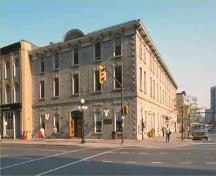 Corner view of the Former Geological Survey of Canada Building showing the continuation of limestone masonry for all cladding and trim, 1991.; Parks Canada Agency / Agence Parcs Canada, 1991.