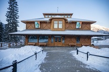 General view showing the stepped massing defined by the wide bracketed veranda, hipped roof form of the main block, and the lantern set at the top of the roof.; Parks Canada | Parcs Canada / Kahli April