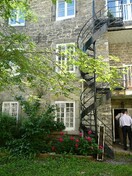 View of the courtyard at Louis-Joseph Papineau National Historic Site of Canada, 2007.; Agence Parcs Canada / Parks Canada Agency, 2007.