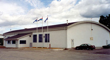 Side view of Hangar 11 at Hangar Line, showing the lean-to shed on its eastern façade.; Parks Canada Agency/ Agence Parcs Canada, les affaires publiques de la Force aérienne/ Défense nationale - Air Force Public Affairs / National Defence