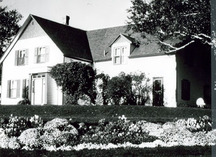 View of the exterior of Green Gables House, showing the window arrangement and the green shutters as well as the gable ends which have traditionally been green, 2000.; Parks Canada | Parcs Canada, J. Sylvester, 2000.
