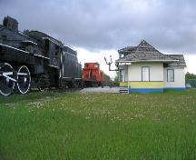West elevation showing the relationship between the station building and the locomotive and railcars.; Government of Saskatchewan, Brett Quiring, 2005.