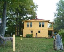 Side elevation showing concrete deer, birth bath and bust; Charles Macdonald House, Centreville, NS, 2005.; Heritage Division, NS Dept. of Tourism, Culture and Heritage, 2005.