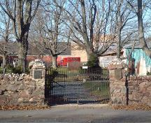 Main entrance and rubble wall, Old Cemetery, Wolfville, 2005. 

; Heritage Division, NS Dept. of Tourism, Culture and Heritage, 2005